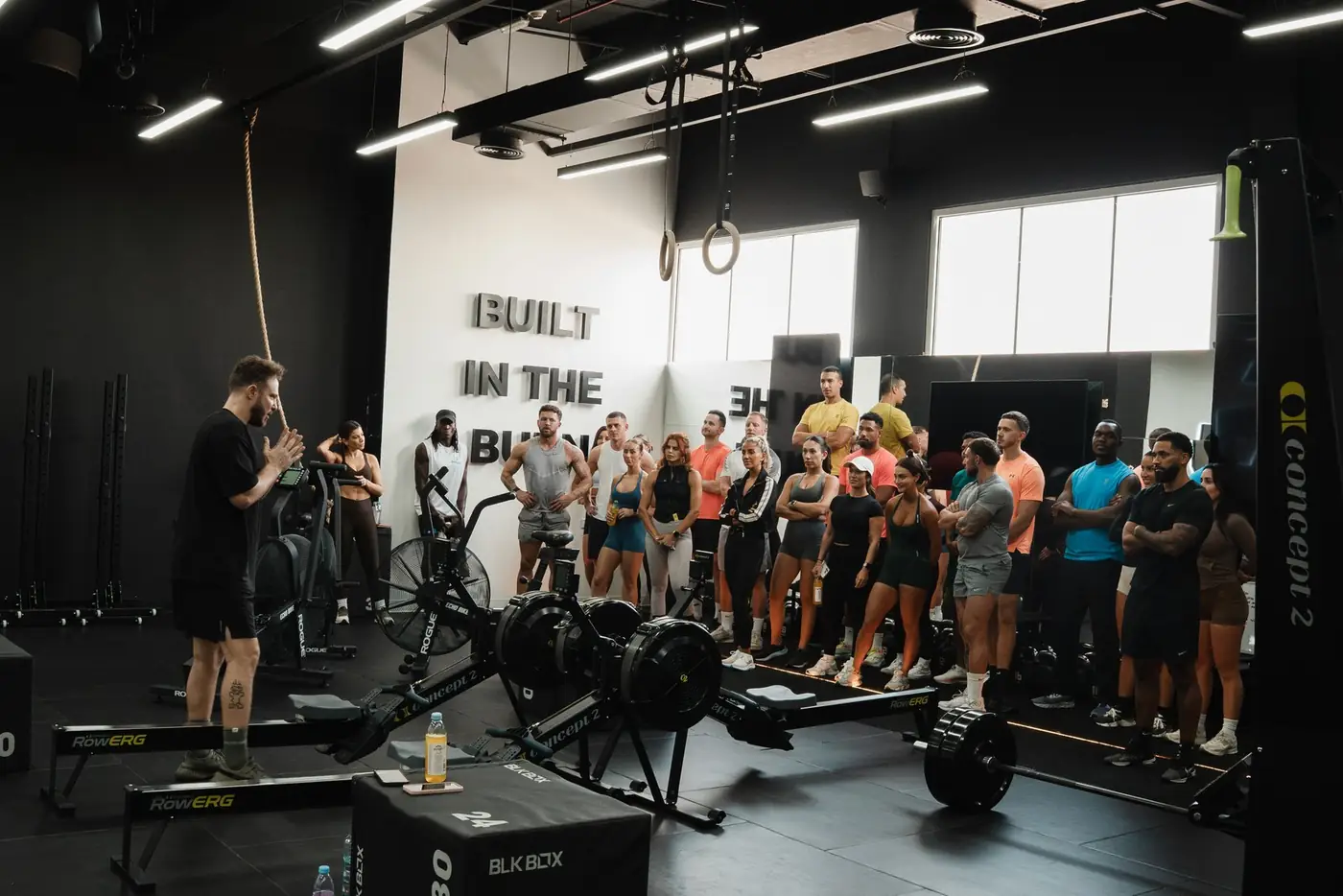 A coach briefing members before class at GRIT