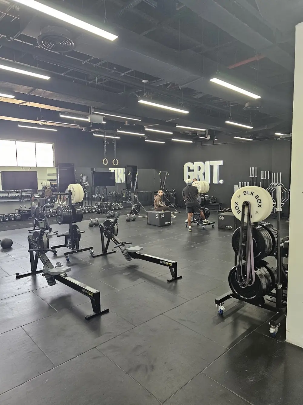 The GRIT floor in daylight with rowers and plate racks